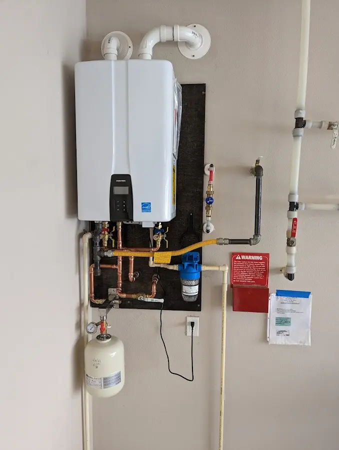 Professional plumber installing copper piping in a Sixteen Mile Stand home